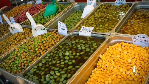 Stroll among the lively stalls of the local market in Pompeii, Campania.