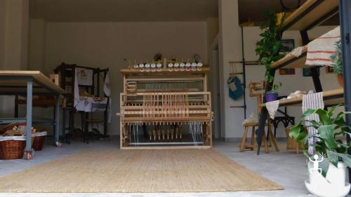 Discover how to weave broom fiber using an antique loom and create a personalized artifact at a workshop in Cilento near Sapri, Campania.