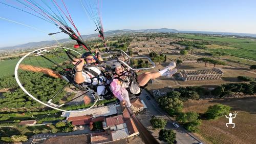 Fly over the temples of Paestum in Cilento with an exciting paragliding experience.