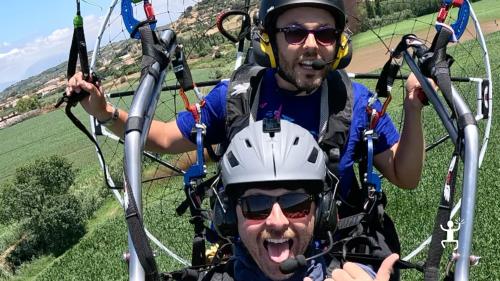 Tandem powered paragliding flight in Capaccio-Paestum for a unique experience.