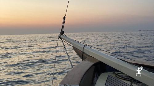 Sailing boat experience to do in summer to see the sunset from the sea in Ischia in Campania