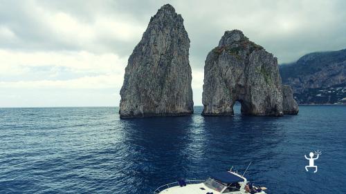 Fascinating views of the Faraglioni, discovering the Mediterranean waters and caves of Capri in Campania with a boat experience