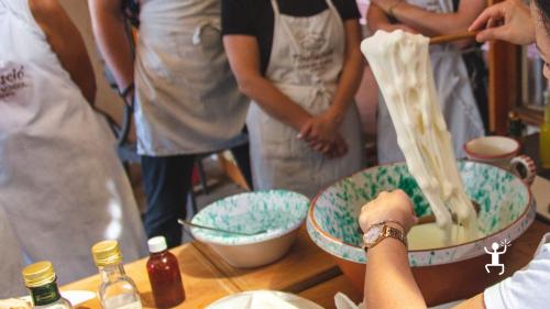 Fresh mozzarella preparation and tasting in Sorrento for family activities in Campania, Italy